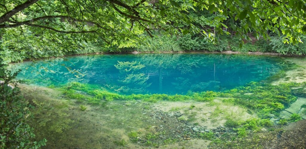 The deep blue hues of the natural karst spring in Blaubeuren attract hundreds of thousands of visitors every year.